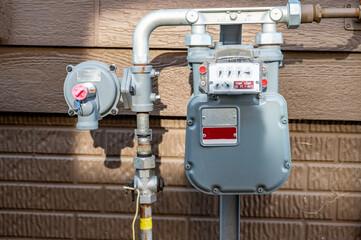 Utility professional documenting a residential natural gas meter for generator fuel line coordination
