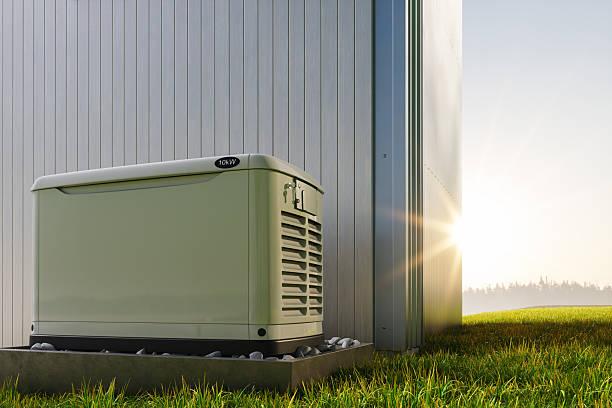 Standby generator mounted on an elevated pad with stone base at a residential property