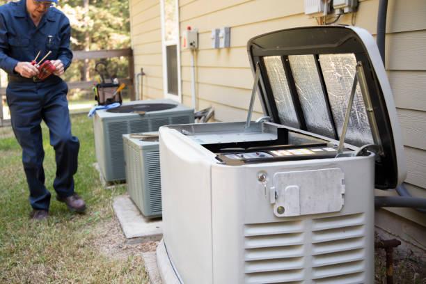 Licensed technician servicing a home standby generator during installation or maintenance